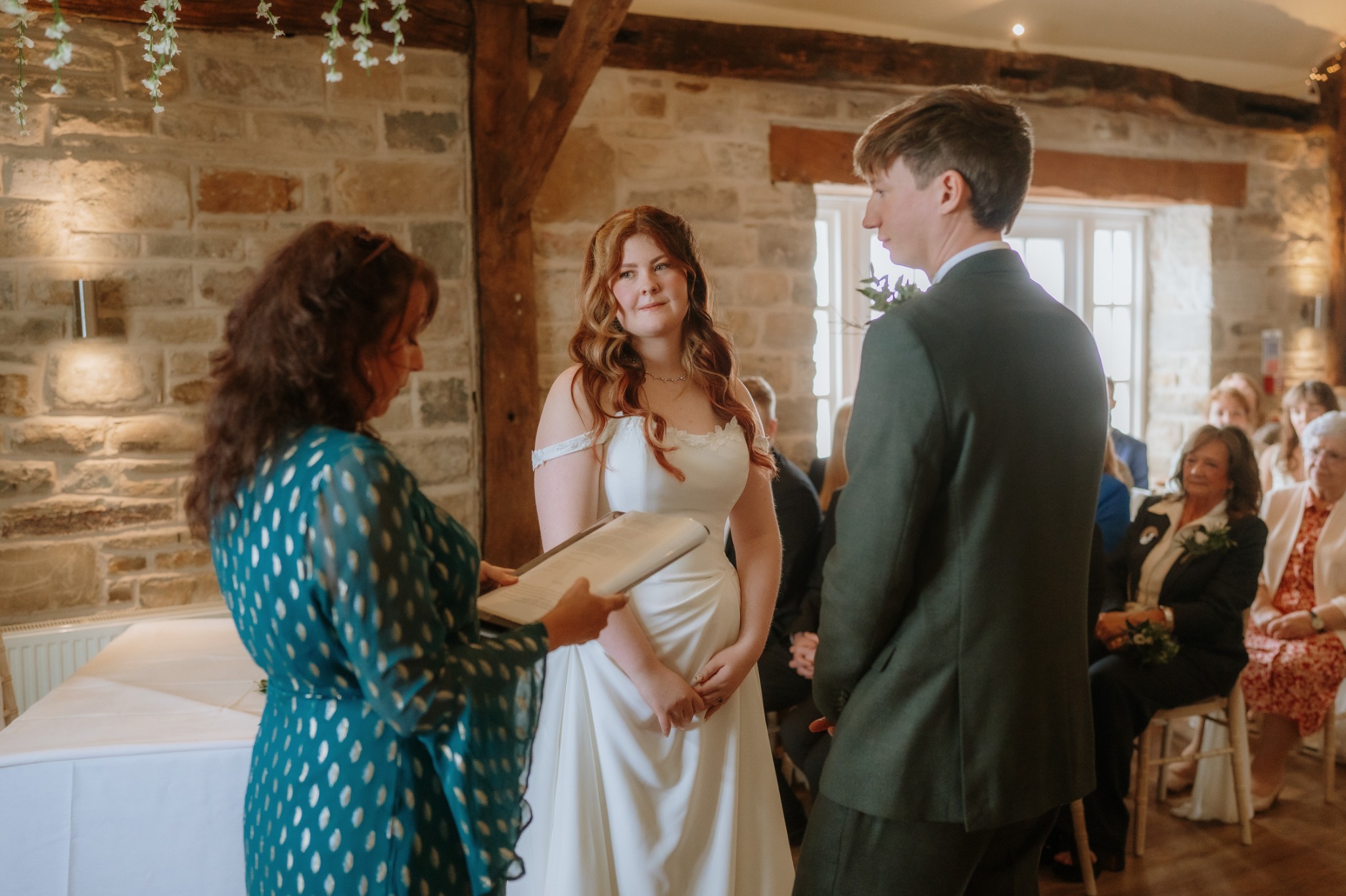 Rebecca conducting a wedding ceremony indoors